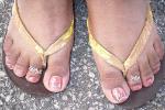 Customer wearing silver sweetheart and silver butterfly toe rings